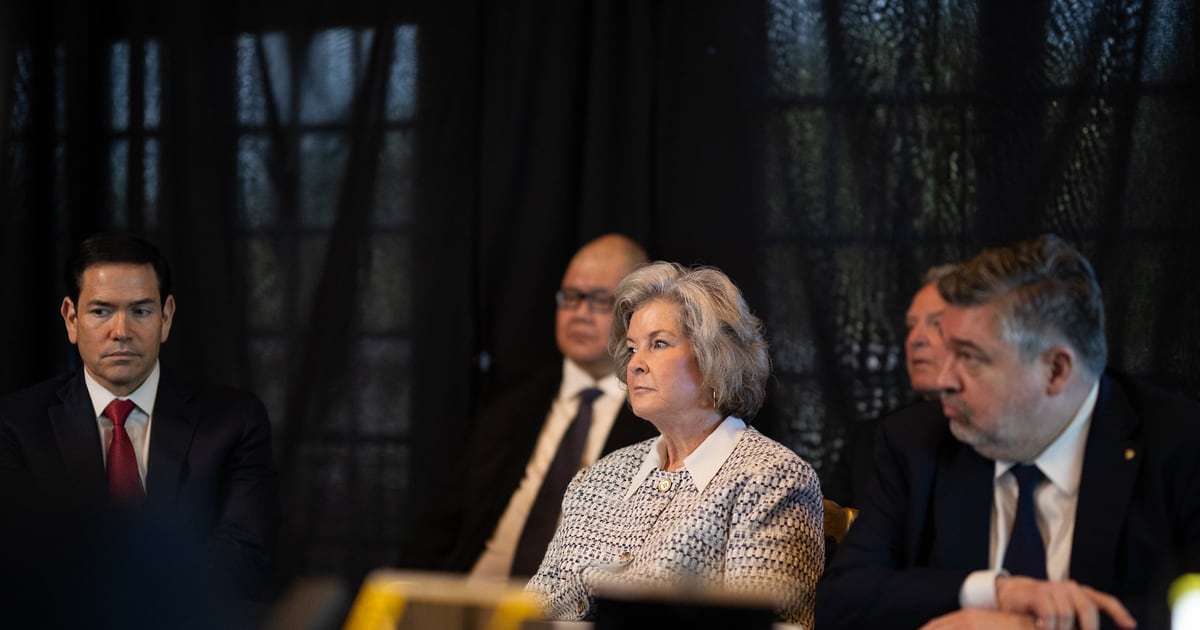 Susie Wiles listens beside President Trump at Mar-a-Lago