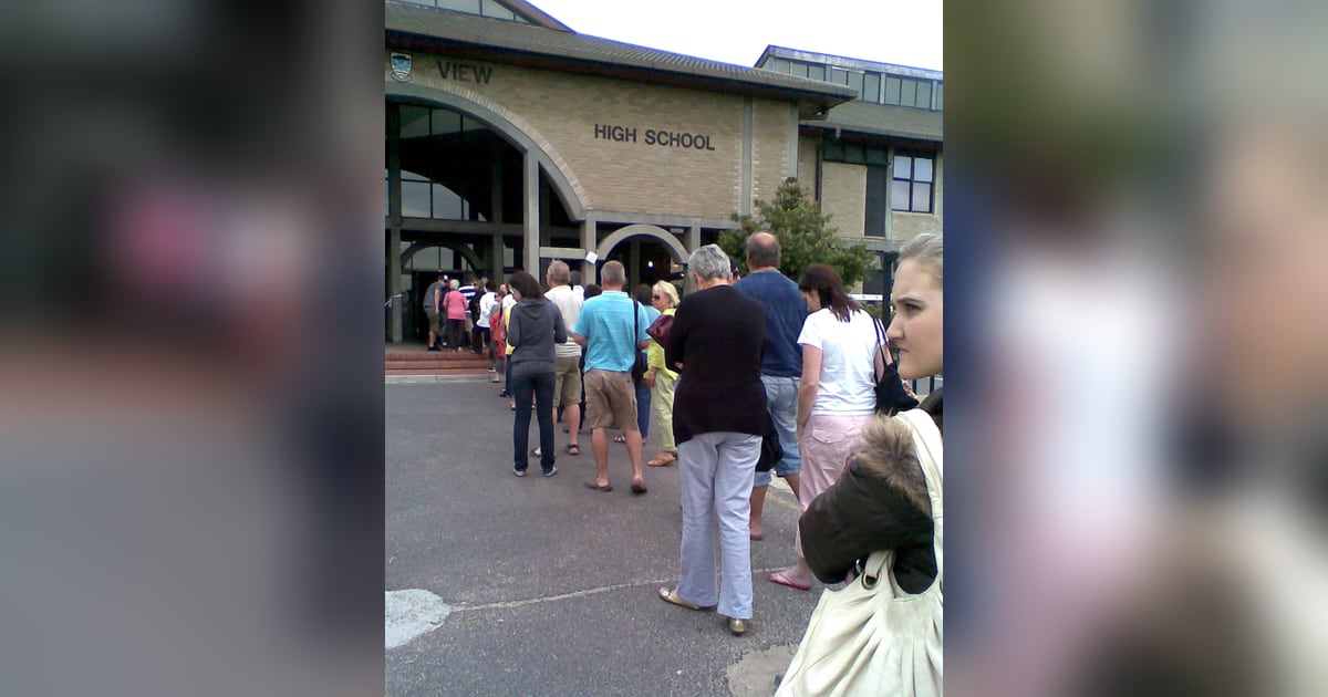 Voters standing in a queue at a South African polling station