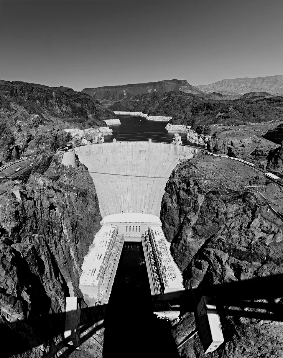 Hoover Dam holding back Lake Mead, with the reservoir's pale shoreline visible